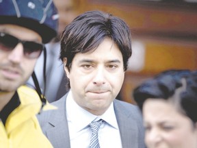 Former CBC host Jian Ghomeshi leaves the Old Toronto City Hall Courthouse on Wednesday after apologizing in open court for ?sexually inappropriate? behaviour toward a former coworker and signing a peace bond. (Peter J. Thompson/Postmedia Network)
