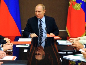 Russian President Vladimir Putin chairs a Security Council meeting in the Bocharov Ruchei residence in Sochi, Russia, Friday, May 13, 2016. (Mikhail Klimentyev/Sputnik, Kremlin Pool Photo via AP)
