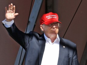 Republican presidential candidate Donald Trump waves as he walks onto a stage for a rally Saturday, May 7, 2016, in Lynden, Wash. (AP Photo/Elaine Thompson)