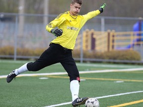 Goalkeeper Hunter Adams of the College Notre Dame Alouettes boys soccer team gets set to make a kick during senior boys high school soccer action in Sudbury, Ont. on Thursday May 12, 2016. Gino Donato/Sudbury Star/Postmedia Network