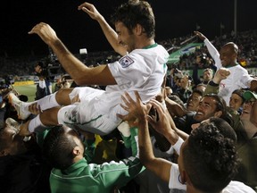 New York Cosmos player Raul Gonzalez celebrates with teammates following their win over the Ottawa Fury for the NASL Championship in Hempstead, New York, November 15, 2015. REUTERS/Brendan McDermid