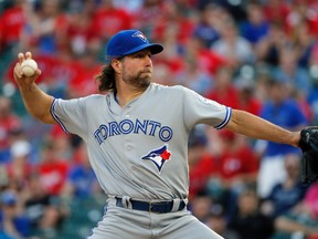 Toronto Blue Jays starting pitcher R.A. Dickey throws to the Texas Rangers during the first inning of a game in Arlington, Texas on May 13, 2016. (AP Photo/Tony Gutierrez)