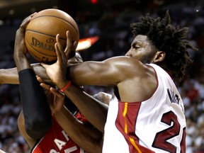 Toronto Raptors' DeMarre Carroll and Miami Heat's Justise Winslow battle for the ball during the second half of Game 6 of the NBA Eastern Conference semifinals at American Airlines Arena in Miami on May 13, 2016. (AP Photo/Alan Diaz)
