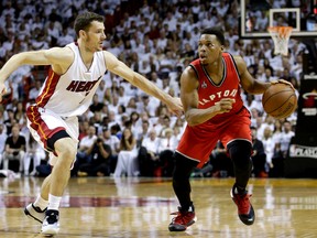 Toronto Raptors' Kyle Lowry drives around Miami Heat's Goran Dragic during the first half of Game 6 of the NBA Eastern Conference semifinals at American Airlines Arena in Miami on May 13, 2016. (AP Photo/Alan Diaz)