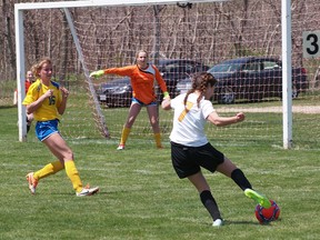 Tenishga Van Harn lines up a shot in a game against West Elgin.