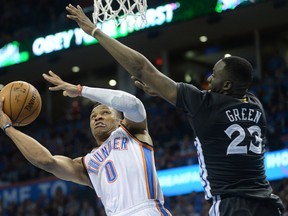 Oklahoma City Thunder guard Russell Westbrook (0) drives to the basket against Golden State Warriors forward Draymond Green (23) at Chesapeake Energy Arena. (Mark D. Smith-USA TODAY Sports)