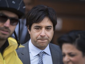 Former CBC host Jian Ghomeshi leaves the Old Toronto City Hall Courthouse after signing a peace bond in Toronto on May 11, 2016. Peter J. Thompson/Postmedia Network