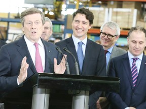 Prime Minister Justin Trudeau behind Mayor John Tory (L) during a press conference at the Greenwood Subway Yard on May 6, 2016. Veronica Henri/Toronto Sun/Postmedia Network