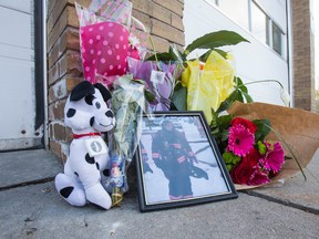 A memorial of flowers and a photograph of fallen firefighter Sara Rosen lays outside her fire hall - Toronto Fire Station 443 - at 1724 Islington Ave. in Toronto on Saturday May 14, 2016. Ernest Doroszuk/Toronto Sun/Postmedia Network