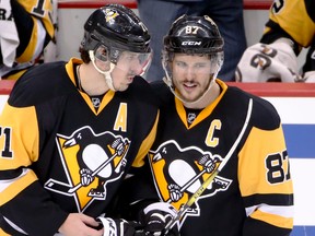Pittsburgh Penguins’ Sidney Crosby (87) and Evgeni Malkin talk as they return to the ice after a stop in play during Game 6 of the Eastern Conference semifinals against the Washington Capitals Tuesday, May 10, 2016 in Pittsburgh. (AP Photo/Gene J. Puskar)