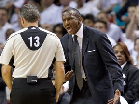 Toronto Raptors coach Dwane Casey, right, has a discussion with referee Monty McCutchen during Game 6 of the NBA Eastern Conference semifinals against the Miami Heat Friday, May 13, 2016, in Miami. (AP Photo/Alan Diaz)