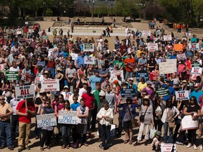 People take part in the, "parent choice" rally at the Alberta Legislature on May 14, 2016 in Edmonton.