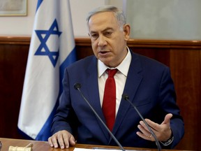 Israeli Prime Minister Benjamin Netanyahu opens the weekly cabinet meeting on May 15, 2016 at his Jerusalem office. (REUTERS/ Gali Tibbon /Pool)