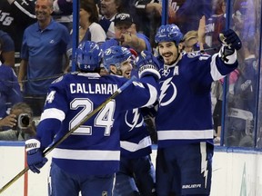 Tampa Bay Lightning's Ryan Callahan congratulates teammate Brian Boyle after Boyle scored a goal during the first period of Game 5 of the NHL hockey Stanley Cup Eastern Conference semifinals against the New York Islanders,  Sunday, May 8, 2016, in Tampa, Fla. (AP Photo/Chris O'Meara)