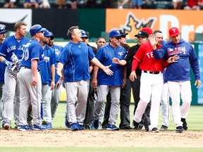 Toronto Blue Jays manager John Gibbons yells at Texas Rangers manager Jeff Banister after the benches cleared in the eighth inning at Globe Life Park in Arlington. Texas won 7-6. (Tim Heitman/USA TODAY Sports)