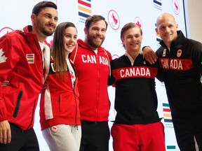 Joseph Polossifakis, Sabre fencing (L) Aurelie Rivard, para-swimmer, Hugo Barrette, Cycling - track; Korey Jarvis, wrestler,  Ben Russell, Canoe/Kayak sprint - were some of the Canadian Olympians headed to the Summer Games in Rio showed off their new uniforms at the Art Gallery of Ontario n Tuesday April 12, 2016. (Jack Boland, Postmedia Network)