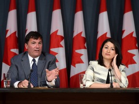 Maryam Monsef, Minister of Democratic Institutions, and Dominic LeBlanc, Leader of the Government in the House of Commons, make an announcement regarding electoral reform during a press conference at the National Press Theatre in Ottawa on Wednesday, May 11, 2016. THE CANADIAN PRESS/Sean Kilpatrick