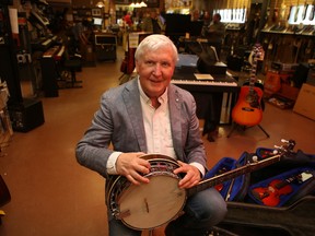 Gary Mullen, owner of Renaissance Music, will have more time to play his banjo when he retires in August. 
Elliot Ferguson/Kingston Whig-Standard