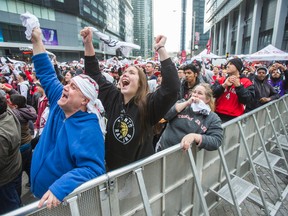 Fans watch game 7 play off action between the Toronto Raptors and the Miami Heat on the large screen at Maple Leaf Square - Jurassic Park - in Toronto, Ont. on Sunday May 15, 2016. (Ernest Doroszuk/Toronto Sun/Postmedia Network)