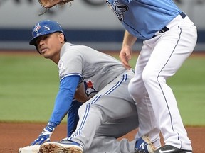 Tampa Bay Rays second baseman Logan Forsythe shows the umpire the ball after tagging out Toronto Blue Jays' Ezequiel Carrera while trying to steal second baseon May 1. (Phelan M. Ebenhack/The Associated Press)