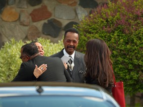 Larry Graham, center, arrive at a Jehovah's Witnesses Kingdom Hall for a memorial service for Prince, Sunday, May 15, 2016, in Minnetonka, Minn. Mourners gathered at Kingdom Hall for a memorial for megastar Prince, who worshipped there before he died last month. (Jeff Wheeler/Star Tribune via AP)