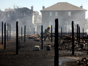 JUL21,2007-Aftermath of a fire that destroyed a condo construction site and destroyed 18 townhouses and damaged another 76 nearby homes in Edmonton's south side. Hundreds of residents were evacuated but no injuries were reported. Damages are estimated between 20 and 25 million dollars.