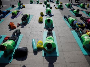 Participants do planking at the Plank Sport Carnival in Beijing, China, May 15, 2016.REUTERS/Kim Kyung-Hoon
