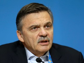 This is a Feb. 18, 2014 file photo of International Ice Hockey Federation president Rene Fasel as he answers a question during a news conference addressing hockey issues at the 2014 Winter Olympics in Sochi, Russia. (AP Photo/Mark Humphrey)