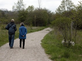 Don and Ruth Bucknell (from left to right) start down the newest extension to the Oxford Thames River Trail in Beachville at the grand opening held on Friday. (BRUCE CHESSELL, Sentinel-Review)