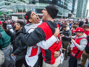 Fans celebrate the Toronto Raptors beating the Miami Heat in Game 7 of their second-round series on May 15, 2016. The Raptors now face the Cleveland Cavaliers in the East Conference final. (Ernest Doroszuk/Toronto Sun)