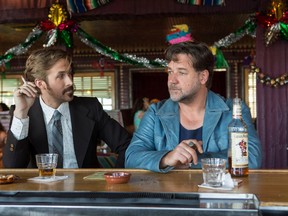 This image released by Warner Bros. Entertainment shows Ryan Gosling, left, and Russell Crowe in a scene from "The Nice Guys." (Daniel McFadden/Warner Bros. Entertainment)