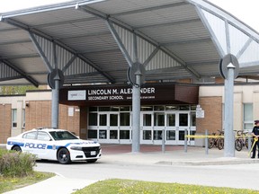 Peel Regional Police at Lincoln Alexander Secondary School in Mississauga where a student was stabbed as part of a fight that occurred in front of the school on Monday May 16, 2016. (Michael Peake/Toronto Sun)