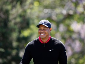 Tiger Woods arrives for a Quicken Loans National golf tournament media availability on the 10th tee at Congressional Country Club, Monday, May 16, 2016 in Bethesda, Md. (AP Photo/Alex Brandon)