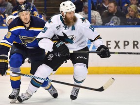 San Jose Sharks centre Joe Thornton and St. Louis Blues defenceman Jay Bouwmeester battle for position during second-period action in Game 1 of the Western Conference final of the NHL playoffs at Scottrade Center in St. Louis on May 15, 2016. (Jasen Vinlove/USA TODAY Sports0