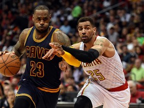 Cleveland Cavaliers forward LeBron James (23) drives past Atlanta Hawks forward Thabo Sefolosha during Game 4 of the second-round playoff series at Philips Arena. (Dale Zanine/USA TODAY Sports)