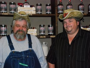 Bill Merckle, left, and Doug Nutter distil legal 90-proof Ohio moonshine in a former general store in downtown New Straitsville, a community with a colourful bootlegging and coal mining history. (WAYNE NEWTON, Special to Postmedia News)