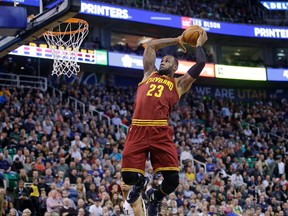 Cleveland Cavaliers forward LeBron James (23) dunks the ball against the Utah Jazz Monday, March 14, 2016, in Salt Lake City. (AP Photo/Rick Bowmer)