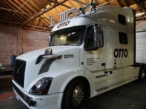 This Thursday, May 12, 2016, photo shows an Otto driverless truck at a garage in San Francisco. An 18-wheel truck barreling down the highway with 80,000 pounds of cargo and no one behind the wheel might seem reckless to most people, even in an age when a few driverless cars already are cruising some city streets. But robot-loving Anthony Levandowski is betting autonomous big rigs will be the next big thing on the road to creating a safer and saner transportation system. (AP Photo/Eric Risberg)