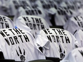 WE THE NORTH t-shirts line the seats before the Toronto Raptors take on the Atlanta Hawks during its season opener at the Air Canada Centre in Toronto on Oct. 29, 2014. (Dave Abel/Toronto Sun)