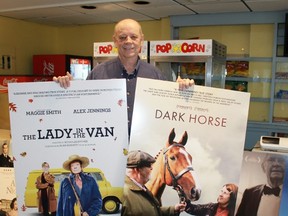Lambton Film and Food Festival chair Glen Starkey stands in the lobby of Forest's venerable Kineto Theatre, holding promotional posters of two of the nine films that will be shown during the four-day long annual festival. 
CARL HNATYSHYN/SARNIA THIS WEEK