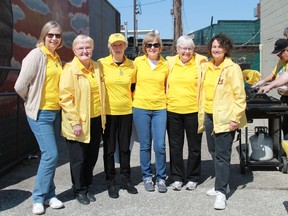 Breastbuddiesone: Members of the Breast Buddies Dragon Boat Team spent their day selling hot dogs and burgers to hungry Sarnians during May First Friday festivities. From left to right: Julie Schooley, Phyllis Warmerdam, Gwen Frankland, Susan Hamill, Grace Churcher, Joanne Western, (at BBQ) Rick Schooley and Larry Western.
CARL HNATYSHYN/SARNIA THIS WEEK
