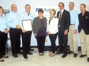 AarKel Tool and Die was named the Wallaceburg and District Chamber of Commerce's feature industry, on May 17. Accepting and giving the recognition, are from left, Valerie Foster, AarKel; Dennis Alexander, AarKel; Larry Delaey, AarKel; Karen Debergh, Wallaceburg and District Chamber of Commerce; Carmen McGregor, councillor Chatham-Kent; Randy Hope, mayor Chatham-Kent; Jim Purdy, AarKel; Mark Matteis, Chamber; and Greg Davenport, Chamber. (David Gough/Postmedia Network)