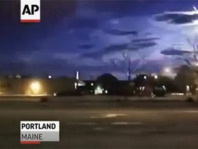 A meteor was captured streaking across the sky in New England via a dashboard camera. (AP video screengrab)
