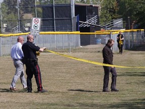 Police investigate after a male was found with serious injuries in Callingwood Park Saturday morning. GREG SOUTHAM / Postmedia