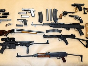 Abbotsford police say they seized weapons that range from a submachine-gun, semi-automatic rifles and pistols to revolvers, and a sawed-off shotgun, along with silencers, magazines and ammunition during a drug bust in Abbotsford, B.C. (Abbotsford police department photo)