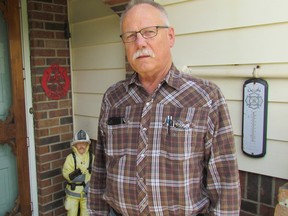 Ron Hayward, standing by his front door on Tuesday May 17, 2016 in Brigden, Ont., says he's stepping down after 44 years with the St. Clair Township community's volunteer fire department. Hayward served as the fire chief in Bridgen for 20 years, until 2003. (Paul Morden, The Observer)