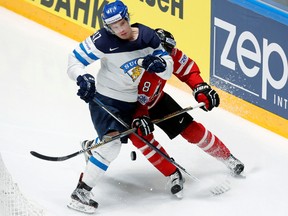 Chris Tanev of Canada in action with Antti Pihlstrom of Finland during a game at the world hockey championship in St. Petersburg, Russia on May 17, 2016. (REUTERS/Maxim Zmeyev)