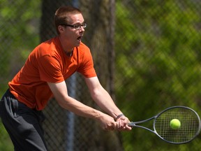 Michael Spriet plays tennis as part of the Salvation Army?s Healthy Homes recreation and life skills program. Spriet traded shots with his twin brother, David, and other program participants Tuesday. (MIKE HENSEN, The London Free Press)