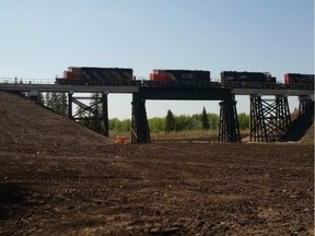 Following an alleged arson on April 26 that destroyed a train trestle bridge near Mayerthorpe, Alta., CN crews worked non-stop for 20 days to construct a replacement.