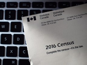 A Statistics Canada 2016 Census sits on the key board of a computer after arriving in the mail at a home in Ottawa in a May 2, 2016, file photo. THE CANADIAN PRESS/Sean Kilpatrick